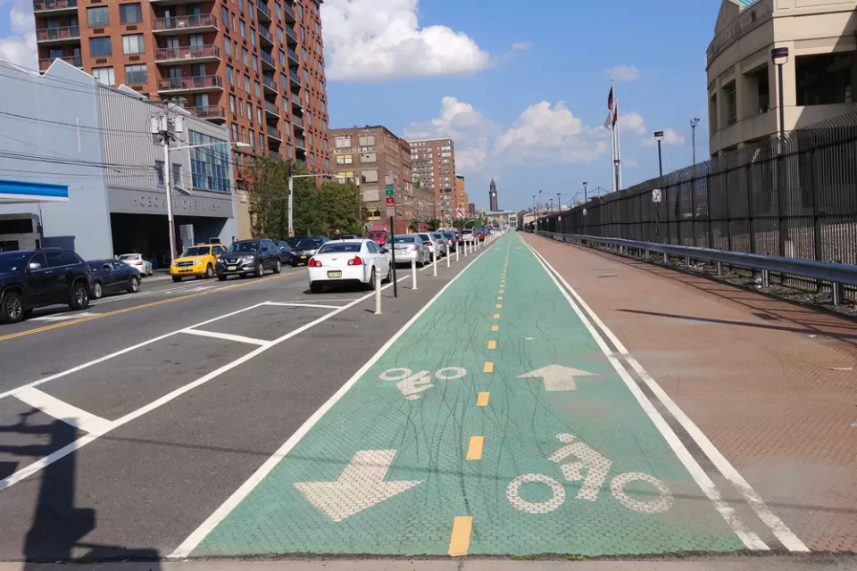 Green painted bike lane with delineators in Hoboken, New Jersey